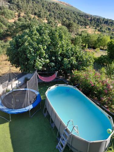 an overhead view of a swimming pool and a tent at Quinta da Àgua in Torre de Moncorvo