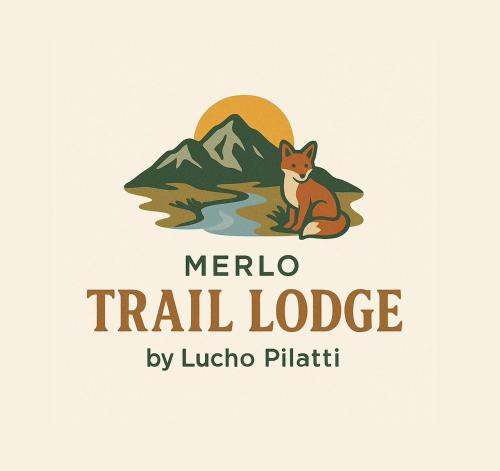 a fox sitting in front of a mountain logo at Merlo Trail Lodge in La Porteña
