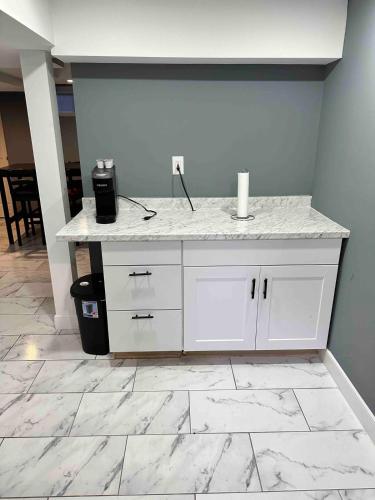 a counter in a room with white marble floors at Cozy 1BR Basement Unit with Private Entry & Free Parking in Washington, D.C.