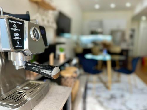 a close up of a coffee machine on a counter at Hotel-Style, No Host, Professionally Managed ID255 in Jersey City