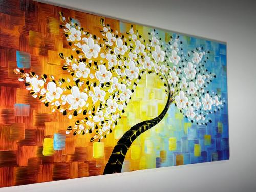 a painting of a tree with white flowers at Hotel-Style, No Host, Professionally Managed ID255 in Jersey City