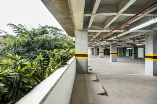 an empty parking garage with yellow and black stripes at Hotel Rioverde - Habitación Estándar in Rionegro