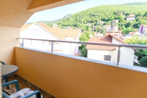 a balcony with a view of a city at Vila Misljenovic, u centru Sokobanje, na pesackoj zoni in Soko Banja