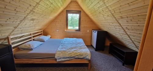 Postel nebo postele na pokoji v ubytování Domek Wypoczynkowy W Brajnikach