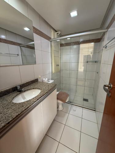 a bathroom with a sink and a shower at Life Resort Apt N-313 in Brasília