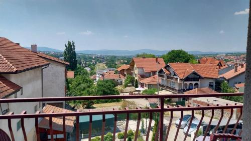 a view of a town from the balcony of a house at Orhideja smeštaj Sokobanja in Lepterija