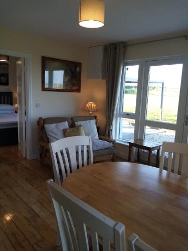a living room with a table and a couch at Seaview House in Carrick