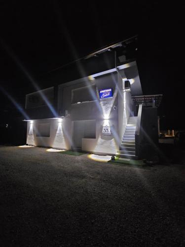 a building with stairs and lights at night at ENA 1&2 -BIG FREE PRIVAT parking for BOATS, TRUCKs, combi,-CENTRAL HEATING !!! in Karlovac