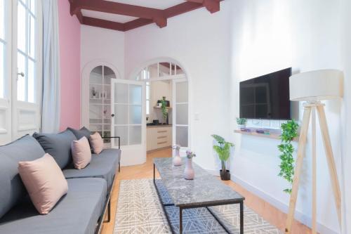 a living room with a couch and a table at Fliphaus Mansion Paz A 10 pax Deluxe House Belgrano in Buenos Aires