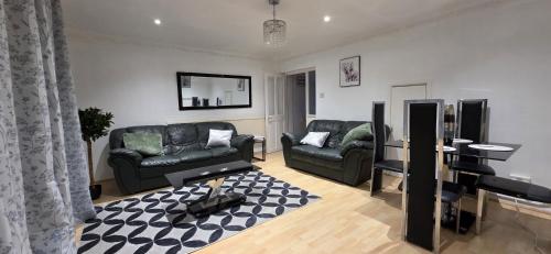 a living room with two couches and a piano at E13 x DM4 weekly monthly deals in London