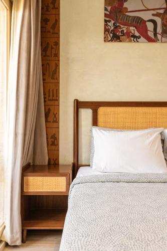 Un ou plusieurs lits dans un hébergement de l'établissement Jimmy Pyramids Hotel