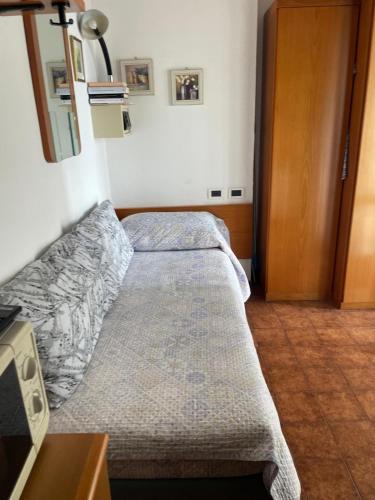 Ένα ή περισσότερα κρεβάτια σε δωμάτιο στο Casavacanze Internazionale