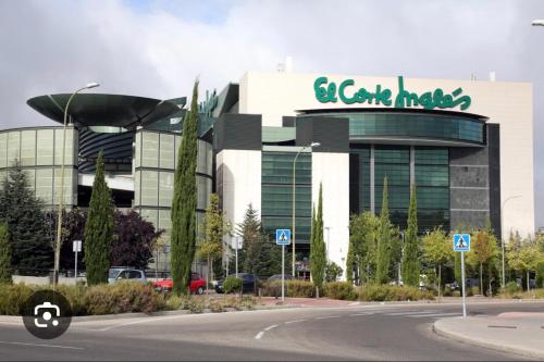 a large building with a car maker sign on it at Lujoso Loft La Moraleja in Madrid
