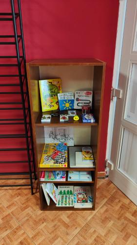 a book shelf filled with lots of books at Dům Slunce in Nové Město pod Smrkem