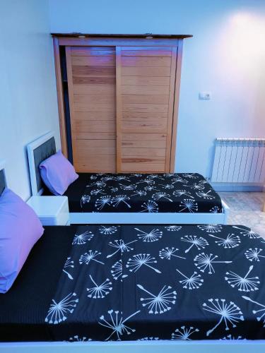 Llit o llits en una habitació de charmant et pratique