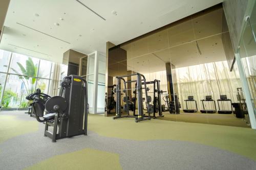 a gym with treadmills and machines in a building at Exclusive and Luxurious 2BR at Wanders & Yoo in Panama City