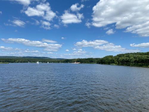 a large body of water with boats on it at Family & Business Sauna Apartments No2 Leśny nad Zalewem Cedzyna - 2 Bedroom with Private Sauna, Bath with Hydromassage, Terrace, Parking, Catering Options in Kielce