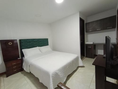 Postel nebo postele na pokoji v ubytování Hotel Hierbabuena y Restaurante