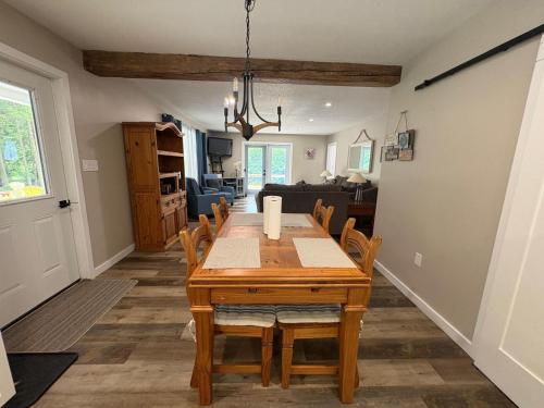 a dining room with a wooden table and chairs at Peninsula Perch in Wiarton