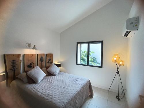 Postel nebo postele na pokoji v ubytování havre de paix au bord de mer - Casa Marina