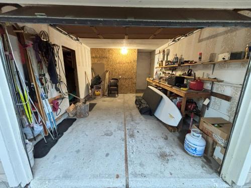 a garage with a room with a sink and a desk at Cozy Cabin in McCall in McCall