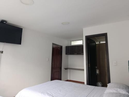 Cama o camas de una habitación en Hotel Hierbabuena y Restaurante