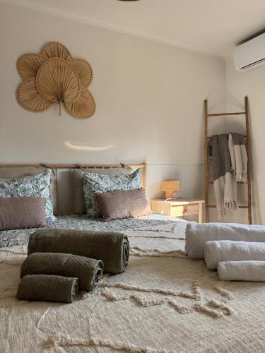 a bedroom with a large bed with pillows on it at Casa dos Sobreiros in Palmela
