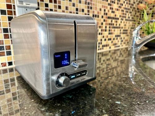 a toaster sitting on a counter in a bathroom at Hotel-Style, No Host, Professionally Managed ID267 in Jersey City