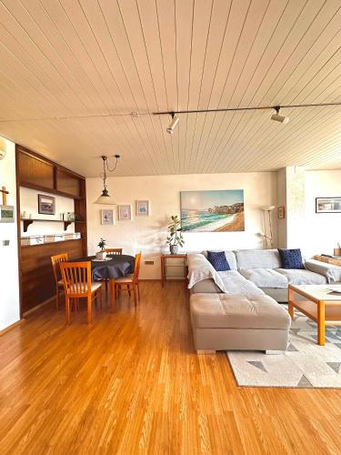 a living room with a couch and a table at Villa Forever More in Kaštela