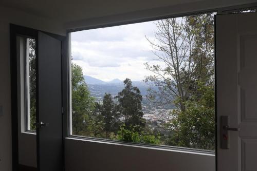 a window in a room with a view at Apartment in Tumbaco - Ilalo in Hacienda Rumihuaicu