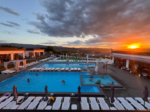 a group of swimming pools on top of a building at Modern House in Solotvyno