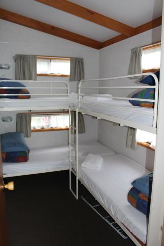 a bunk bed room with two bunk beds in it at Golden Terrace Holiday Park in Lakes Entrance