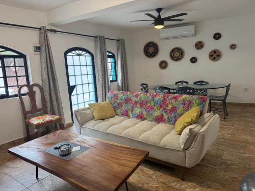 a living room with a couch and a table at Spanish moon pv in Puerto Vallarta