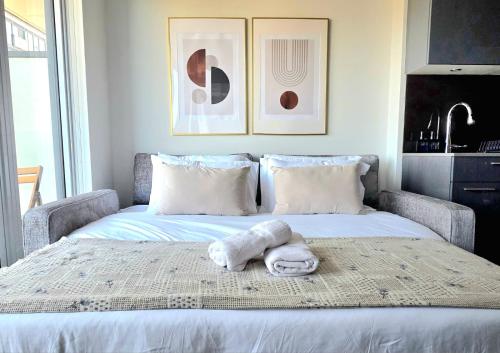 a bedroom with a bed with a towel on it at Classy and Luxury 2 bedroom apartment 5 mins to Dundas Square in Toronto