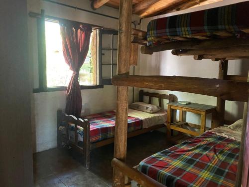 Ένα ή περισσότερα κρεβάτια σε δωμάτιο στο La Lomita - Casa en las sierras de cordoba