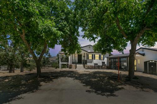 a house with trees in front of it at Desert Mountain Escape with Private Hot Tub home in Tehachapi