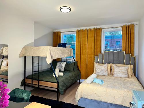 a bedroom with a bunk bed and a couch at Hotel-Style, No Host, Professionally Managed ID280 in Jersey City