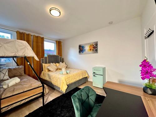 a bedroom with a bed and a bunk bed at BP STAYS - Hotel-Style, No Host, Professionally Managed ID280 in Jersey City
