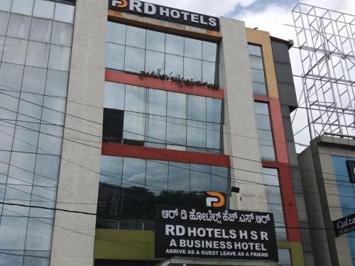 a building with a sign on the side of it at R D Hotels HSR in Bengaluru