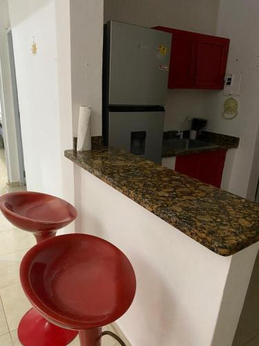 TV a/nebo společenská místnost v ubytování Apartamento hermoso en el centro de la ciudad de moca