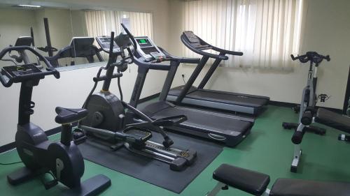 a gym with several exercise bikes in a room at Al Hayat Hotel Apartments in Sharjah