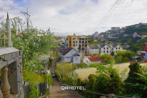 a view of a city from a balcony at QR Hotel Dalat in Xuan An