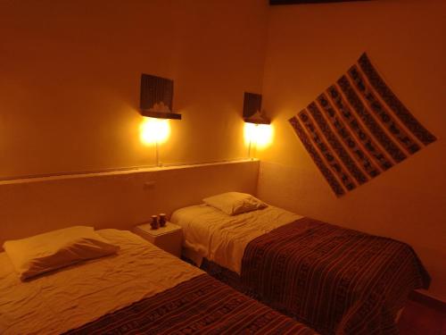 Postel nebo postele na pokoji v ubytování Cabaña Sal y Piedra