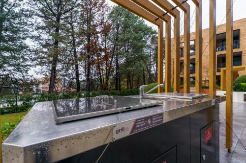 a concrete counter with a sink in front of a building at Luxury Griffith Retreat steps from Iconic Manuka - Hosted by Canstay in Griffith