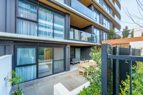 an exterior view of a house with large windows at Luxury Griffith Retreat steps from Iconic Manuka - Hosted by Canstay in Griffith