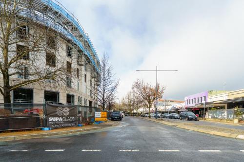 an empty street in a city with a building at Luxury Griffith Retreat steps from Iconic Manuka - Hosted by Canstay in Griffith