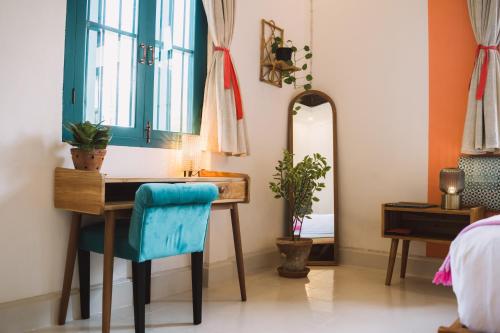 a bathroom with a wooden sink and a mirror at Baan Pila in Luang Prabang