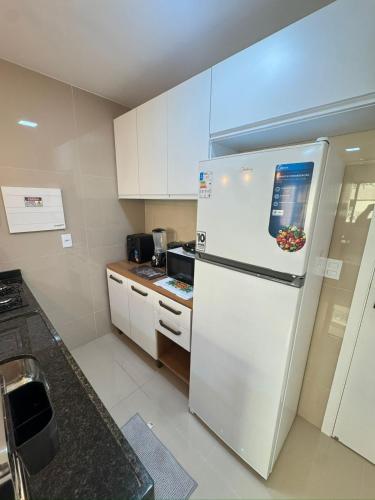 Kuchyň nebo kuchyňský kout v ubytování Ap próx ao shopping com garagem, piscina e ar