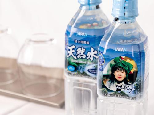 two bottles of water are sitting on a counter at APA Hotel Morioka Ekimae in Morioka