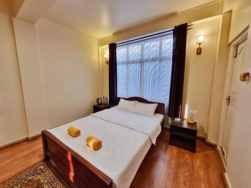 Katil atau katil-katil dalam bilik di The Serenity Homestay, Pohktieh